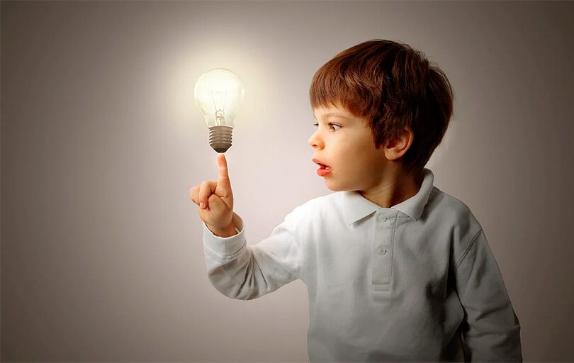 Child with incandescent lamp